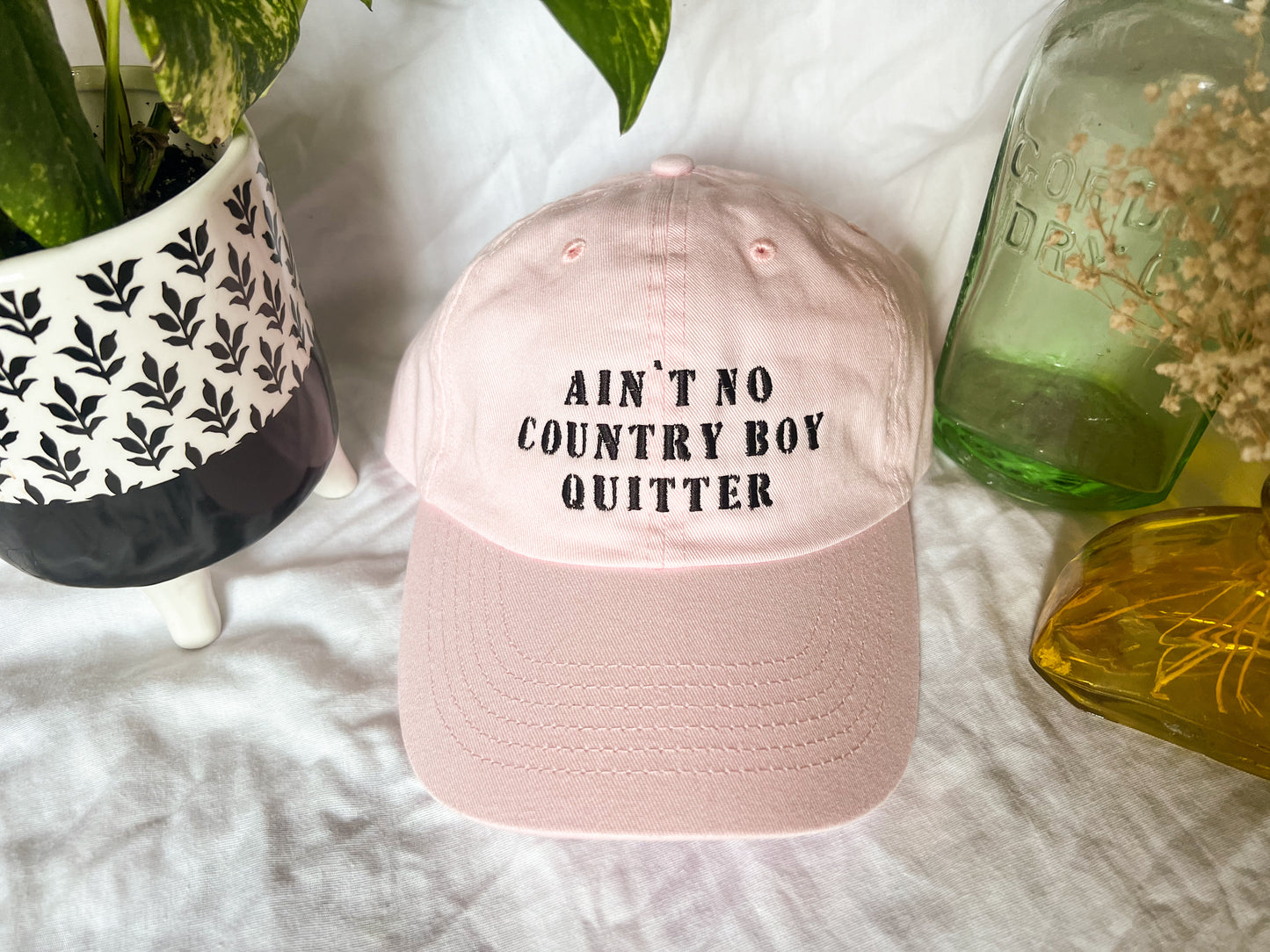 the giver “ain’t no country boy quitter” cap (PREORDER)