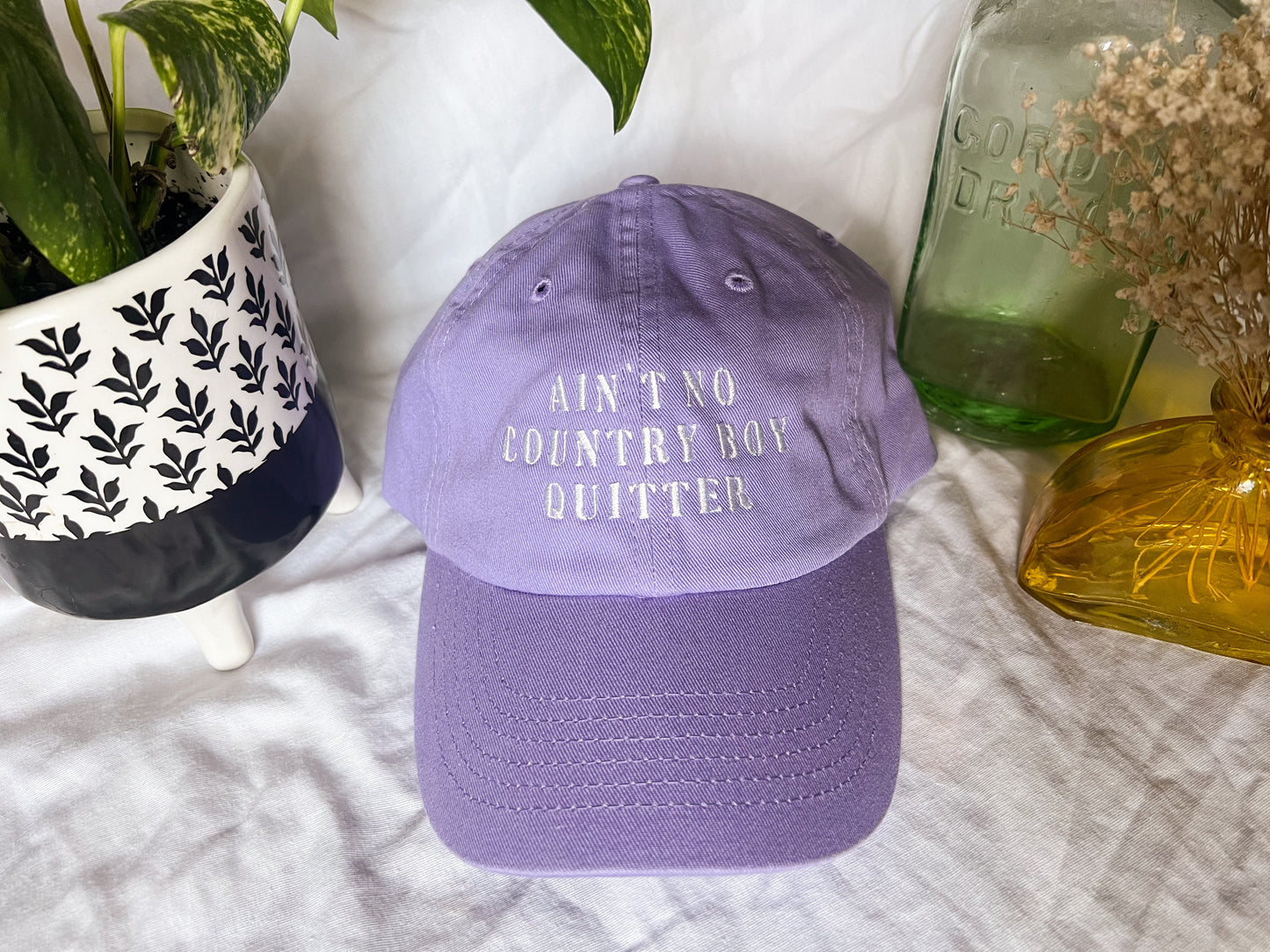 the giver “ain’t no country boy quitter” cap (PREORDER)