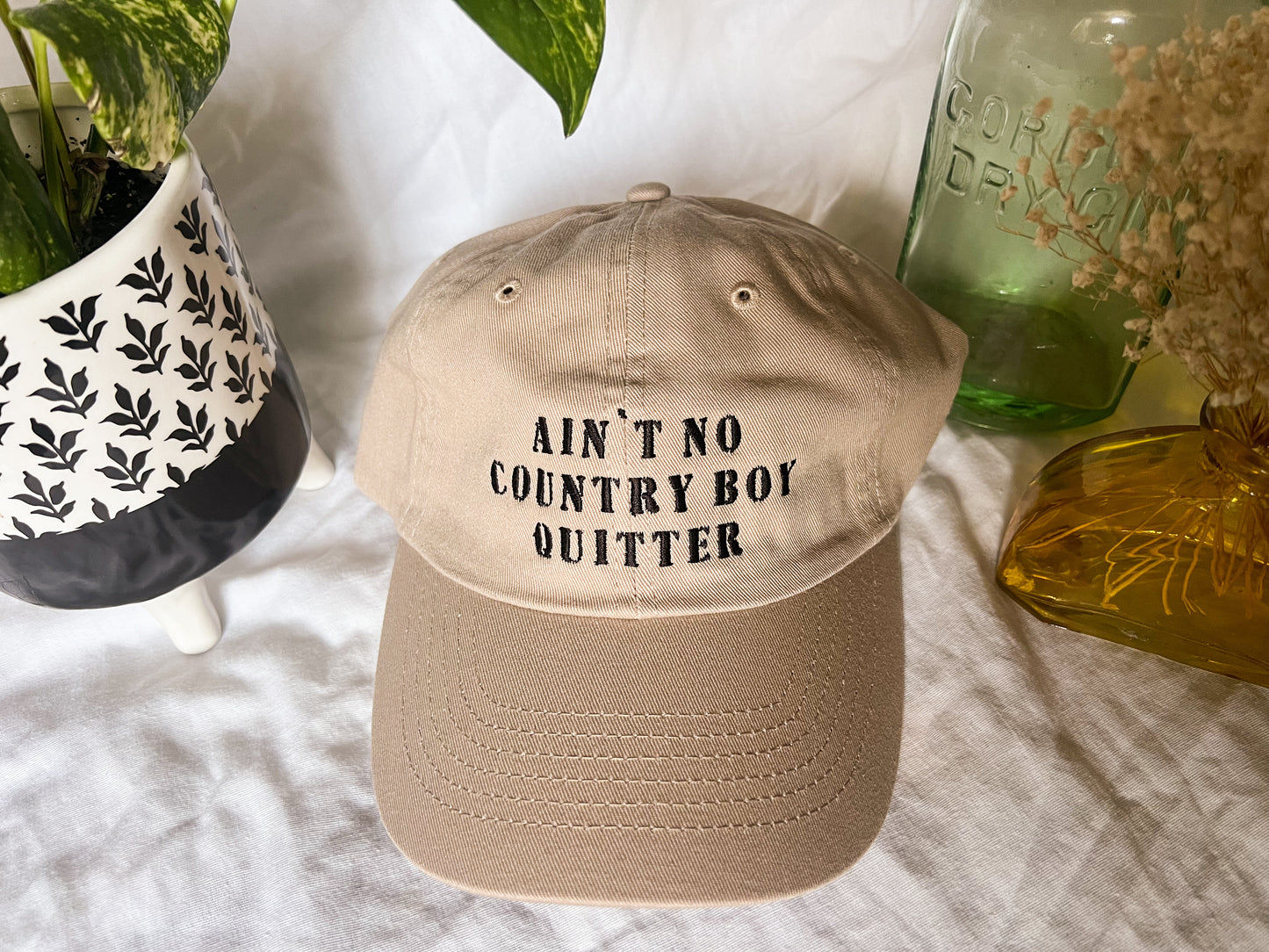 the giver “ain’t no country boy quitter” cap (PREORDER)