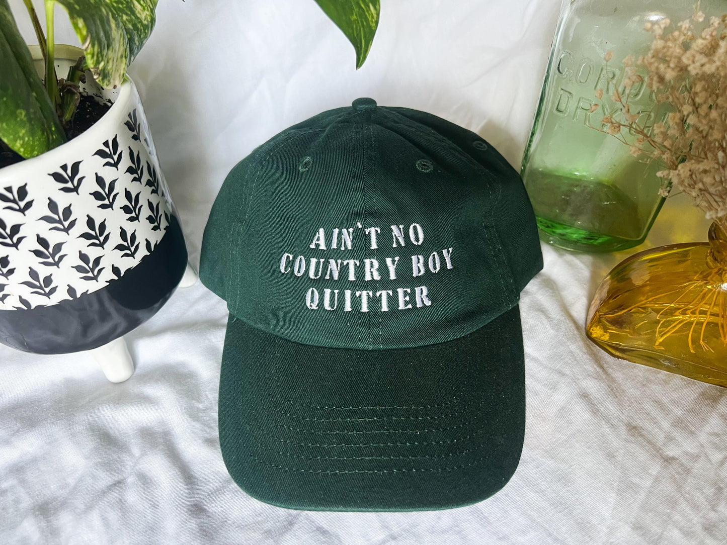 the giver “ain’t no country boy quitter” cap (PREORDER)