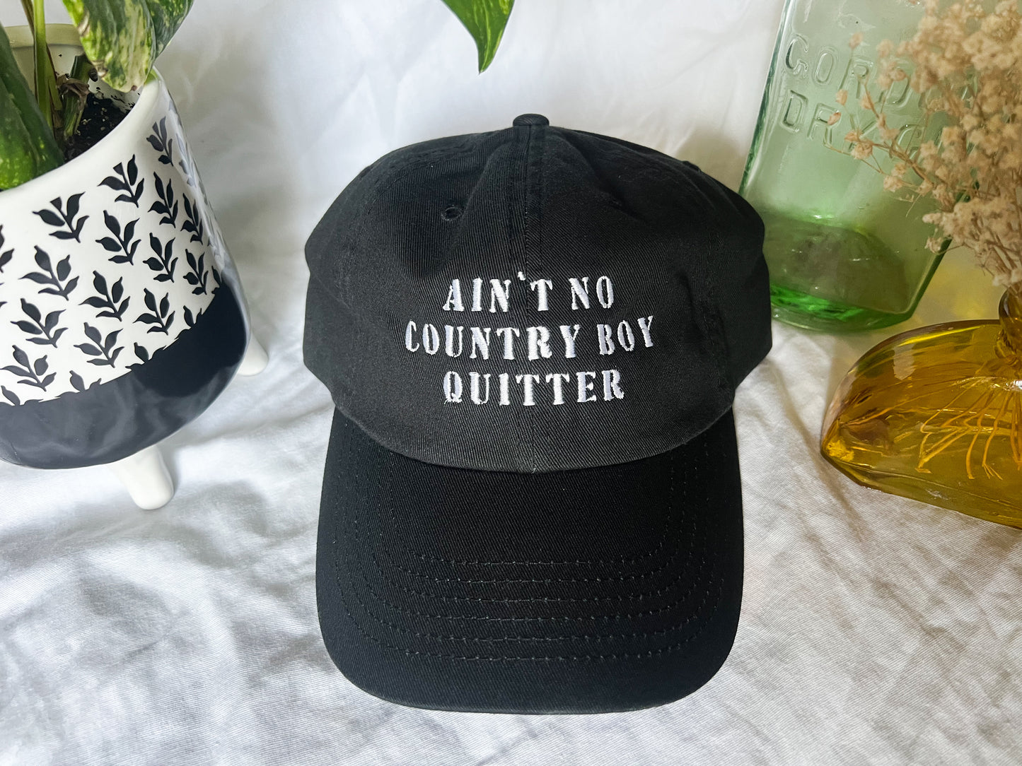 the giver “ain’t no country boy quitter” cap (PREORDER)